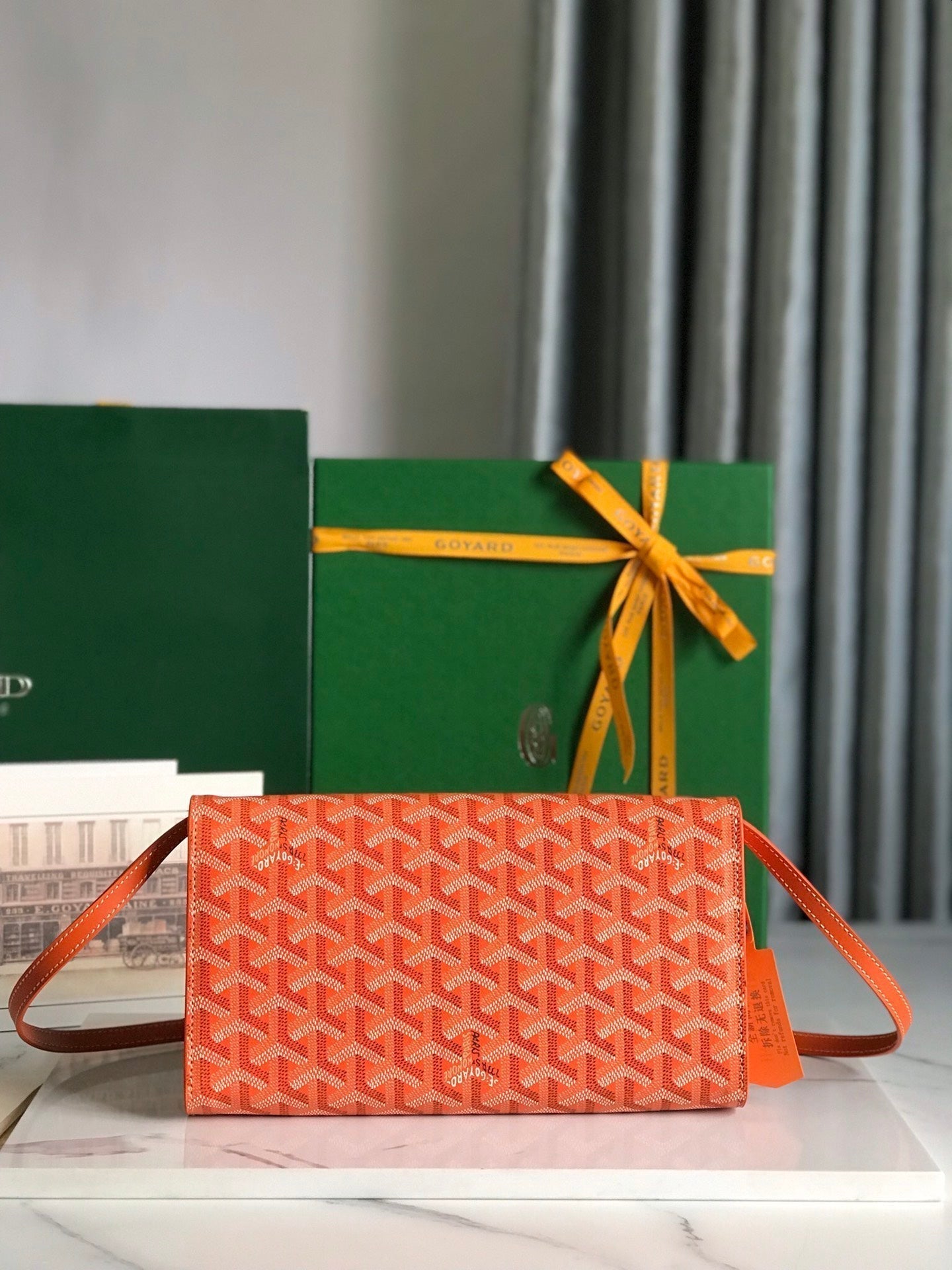 MONTE-CARLO PM CLUTCH 25 IN ORANGE GOYARDINE CANVAS